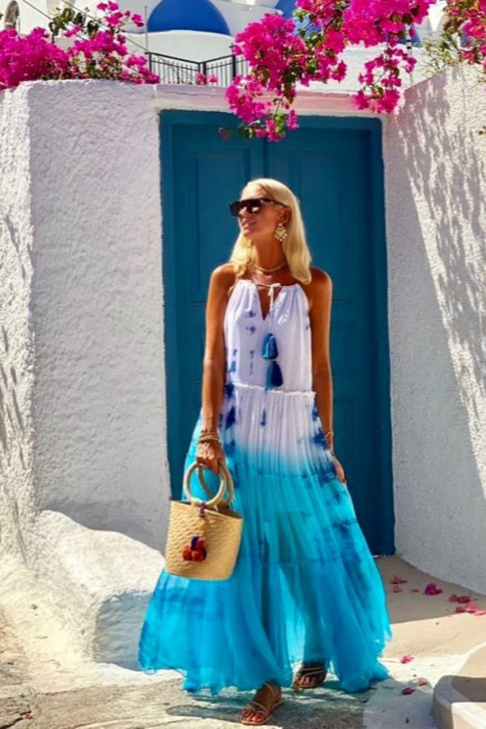 Anna Mavridis wears silk turquoise maxi dress in Santorini by Lindsey Brown