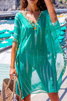 Aqua silk floaty kaftans to wear on holiday to the beach by lindsey brown silk resort wear 