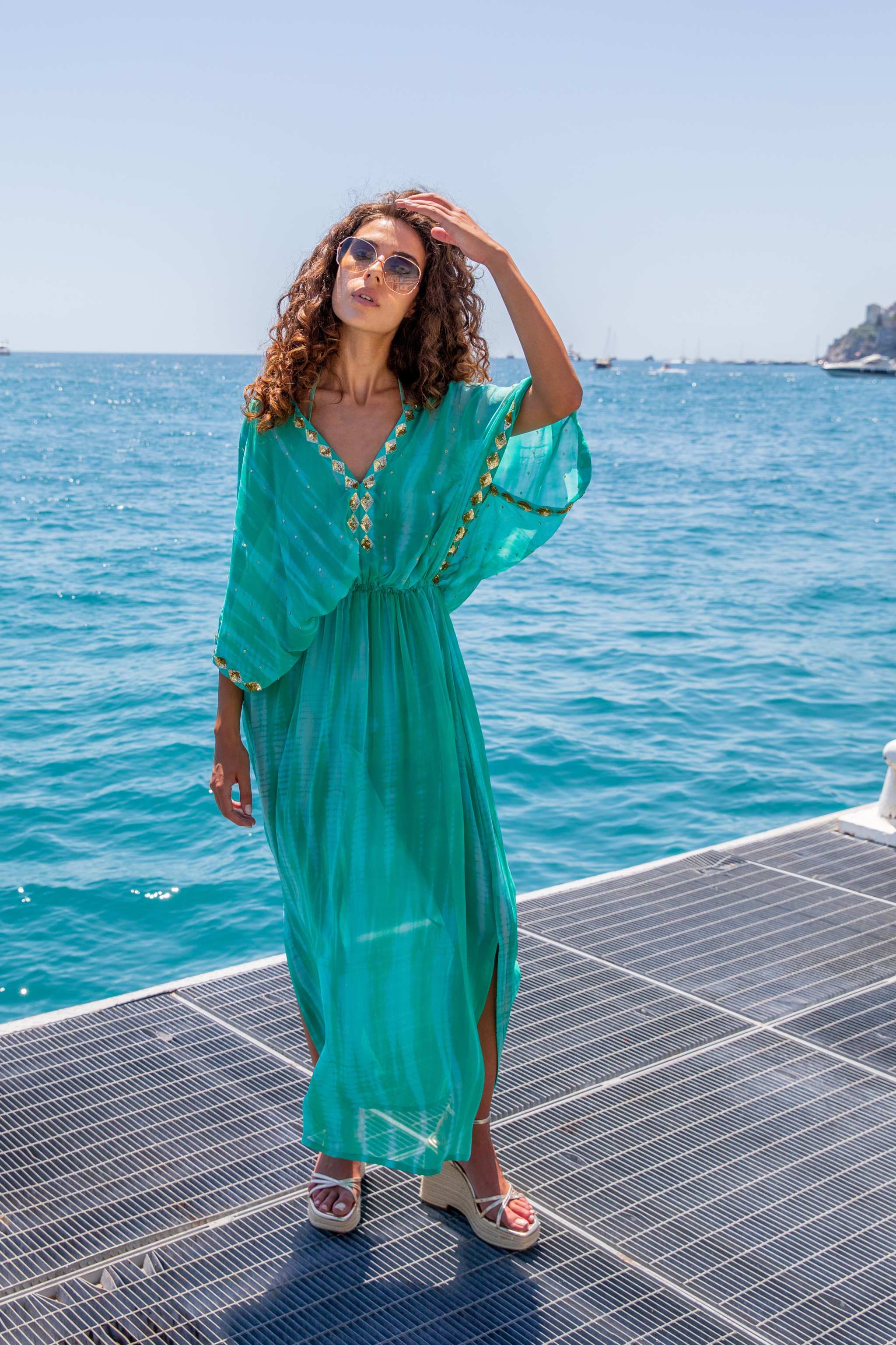 Aqua maxi kaftans to wear over swimwear in a luxury resort by Lindsey Brown