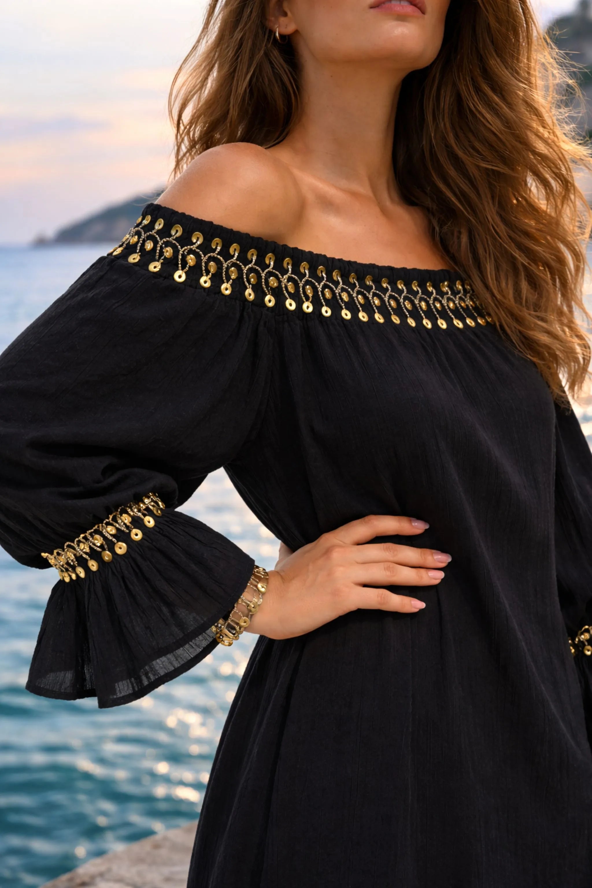 black and gold off the shoulder dress to wear on vacation by Lindsey Brown
