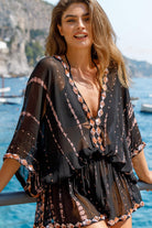 Black short silk designer kaftans to wear on holiday by Lindsey Brown luxury resort wear 
