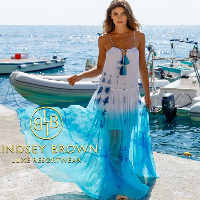 Blue silk Santorini tie dye floaty maxi dress to wear on Winter Sun vacations by  Lindsey Brown luxury resort wear