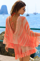 orange silk hand tie dye bloused silk kaftan dress to wear on warm holidays by Lindsey Brown luxury resort wear 