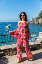 pink printed silk beach trousers by Lindsey Brown resort wear 