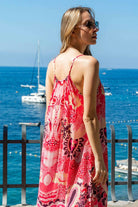 pink printed floaty maxi dresses by Lindsey Brown