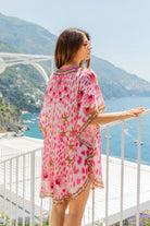 Pink gold animal print silk beach cover ups to wear over swimwear by Lindsey Brown silk resort wear 