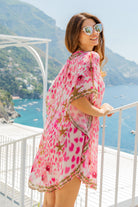 Pink silk floaty beach cover up by Lindsey Brown luxury silk resort wear 