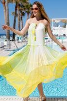 Yellow white silk resort wear dresses to wear in Santorini by Lindsey Brown