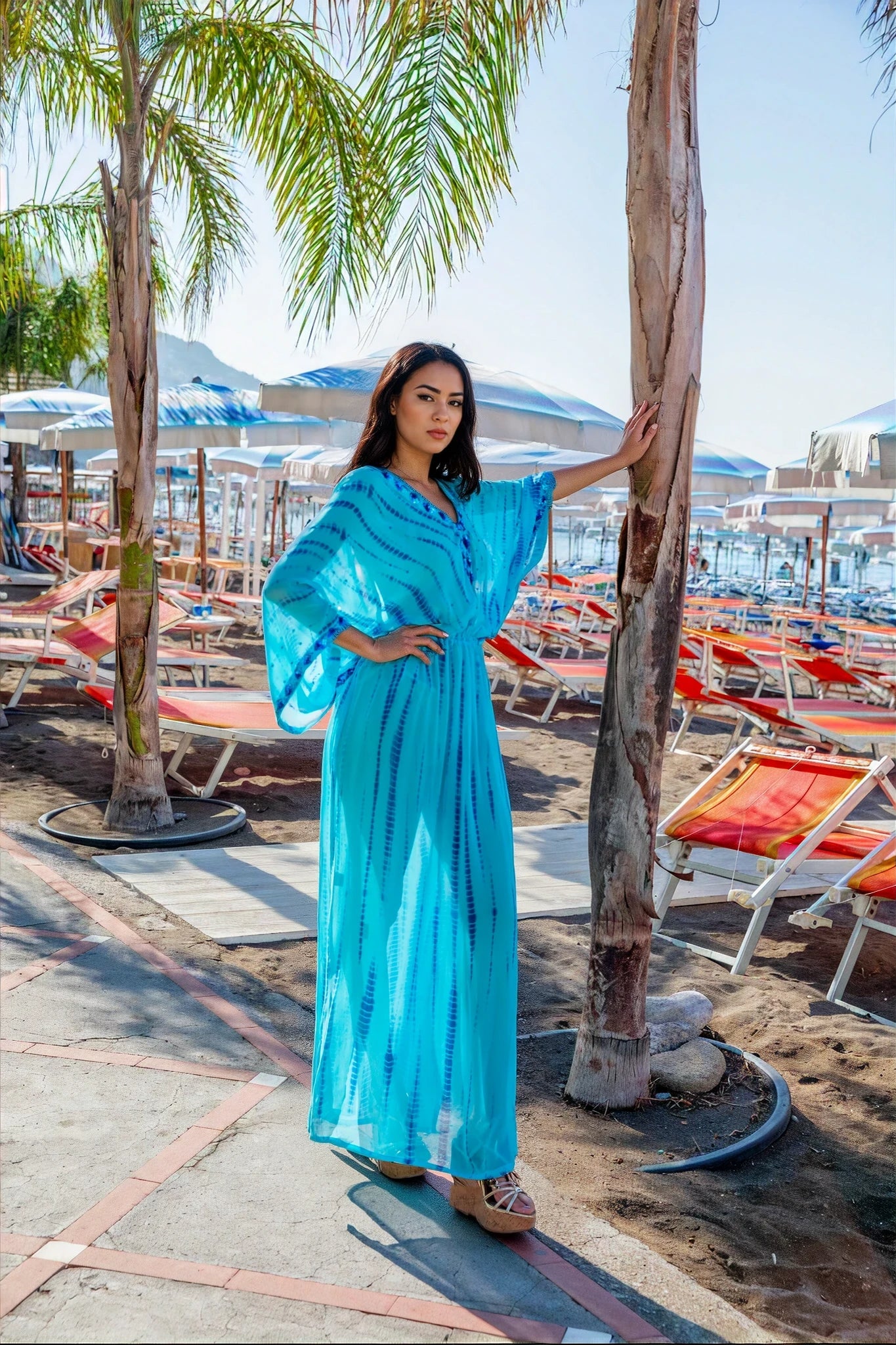 turquoise blue silk maxi kaftans to wear on a warm summer holidays by Lindsey Brown