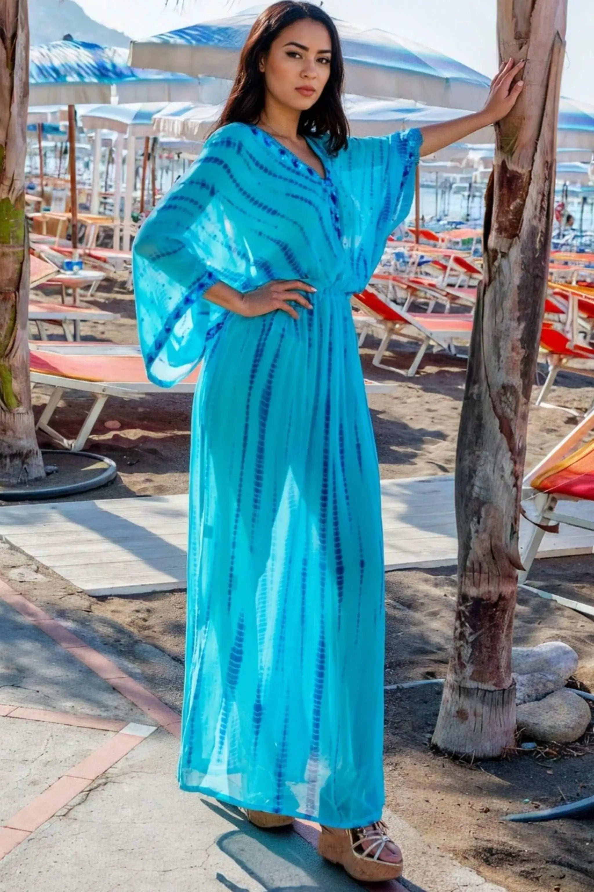 turquoise blue silk maxi kaftans to wear on a luxury vacation by Lindsey Brown
