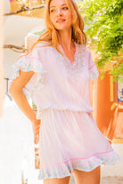 White aqua with pink cotton beach dresses to wear on holiday by Lindsey Brown resort wear