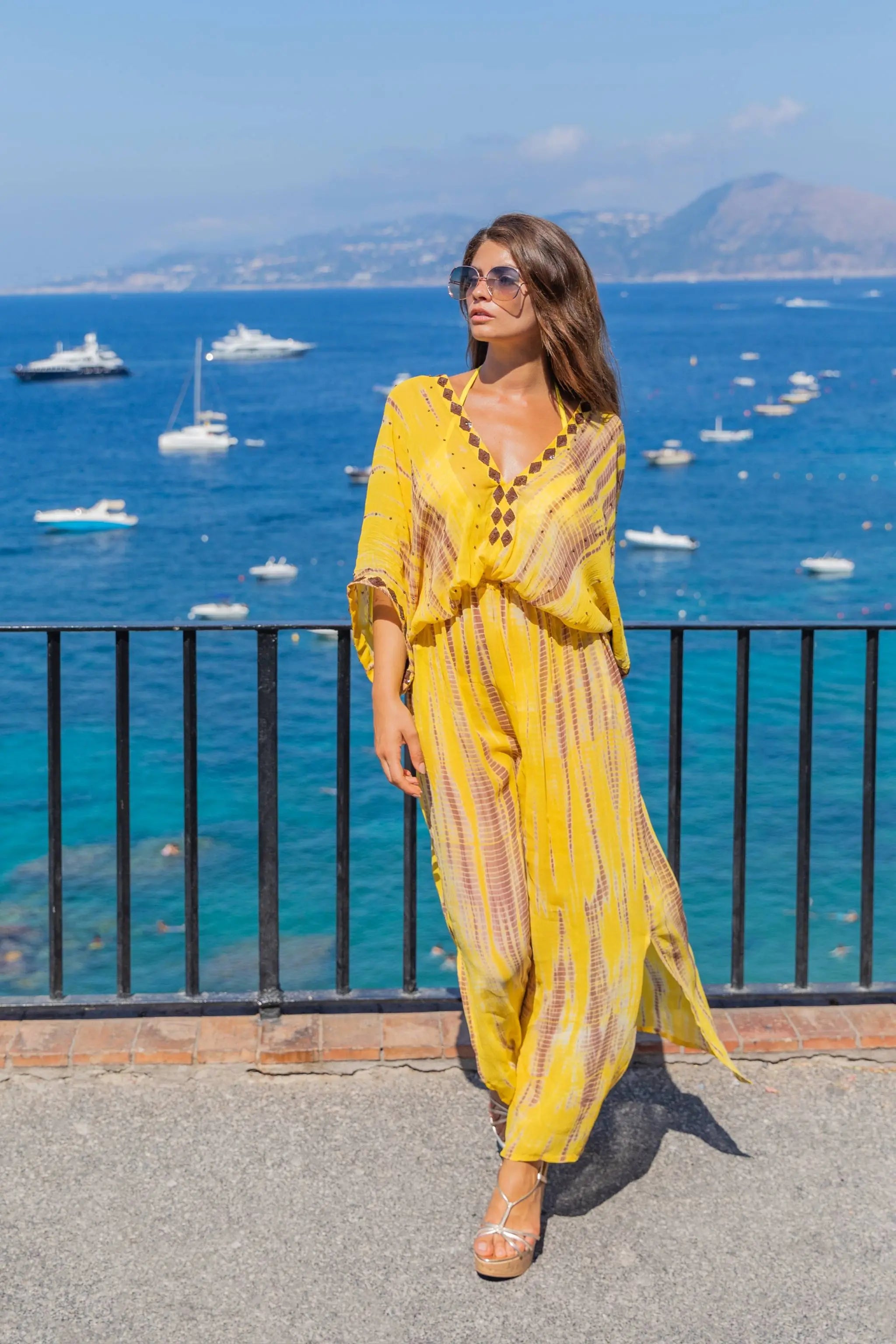Yellow silk floaty maxi kaftans to wear on holiday by Lindsey Brown resort wear 