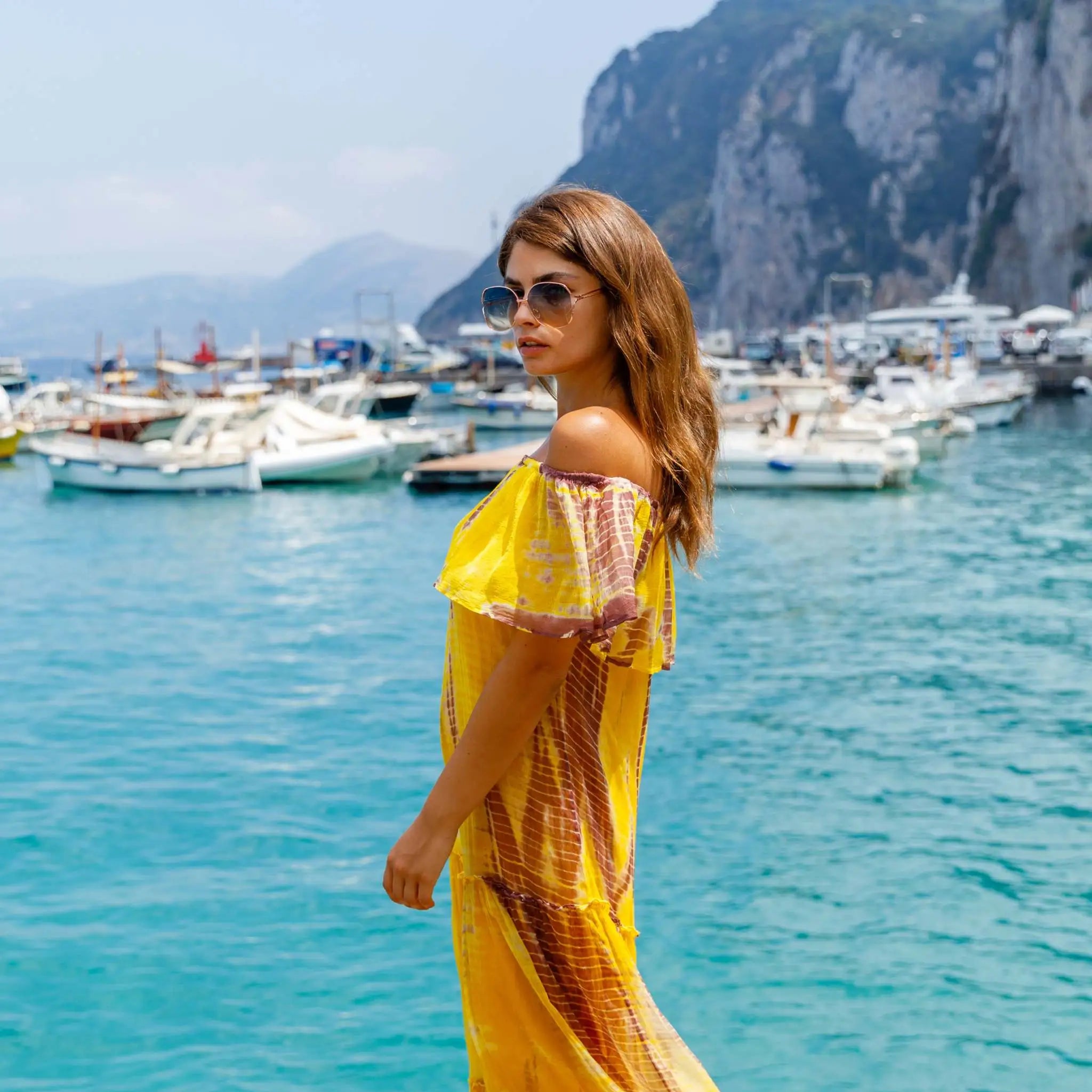 yellow and brown silk tie dye midi dress to wear on vacation by Lindsey Brown resort wear 