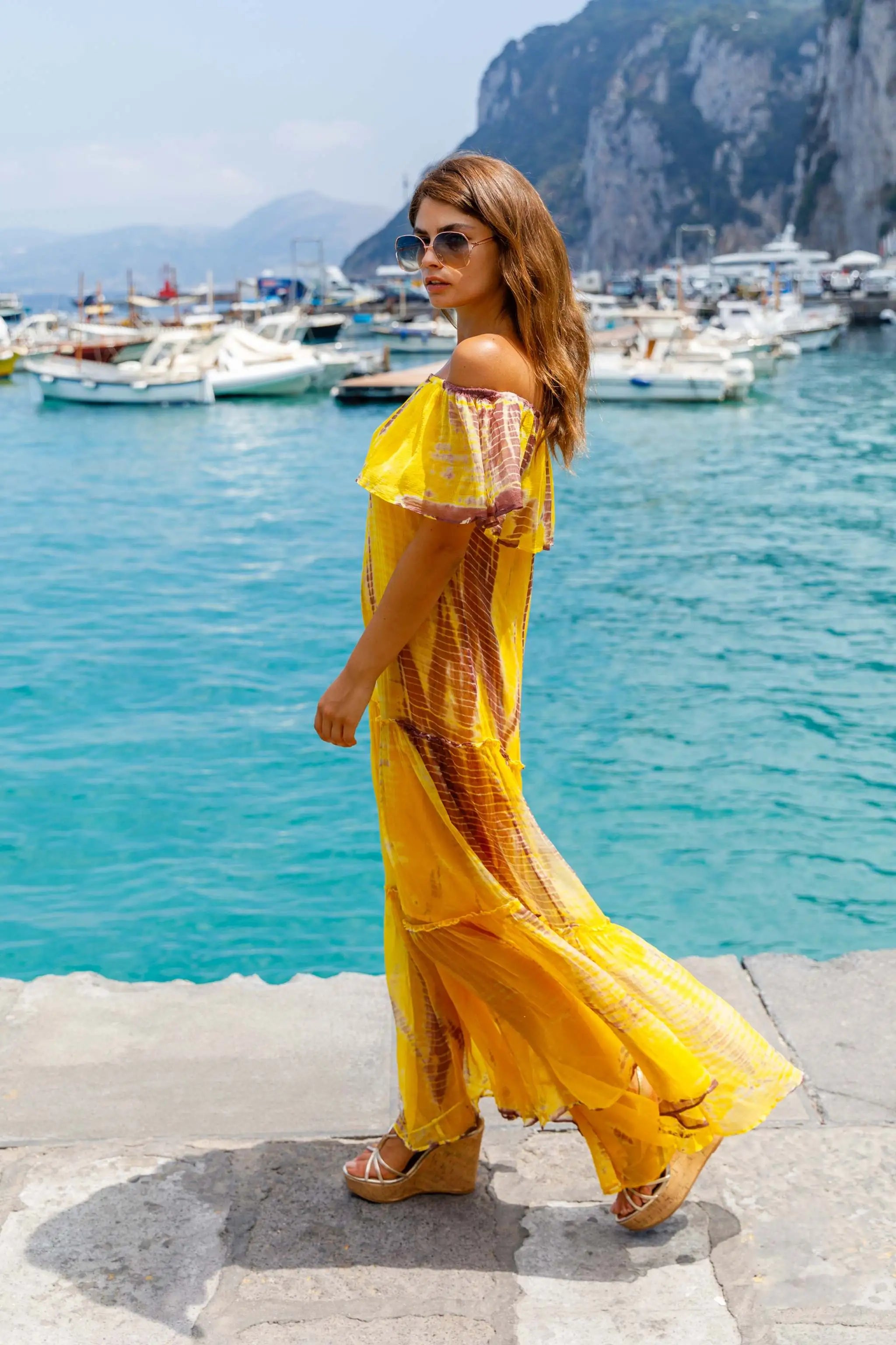 yellow and brown silk tie dye midi dress to wear on vacation by Lindsey Brown resort wear