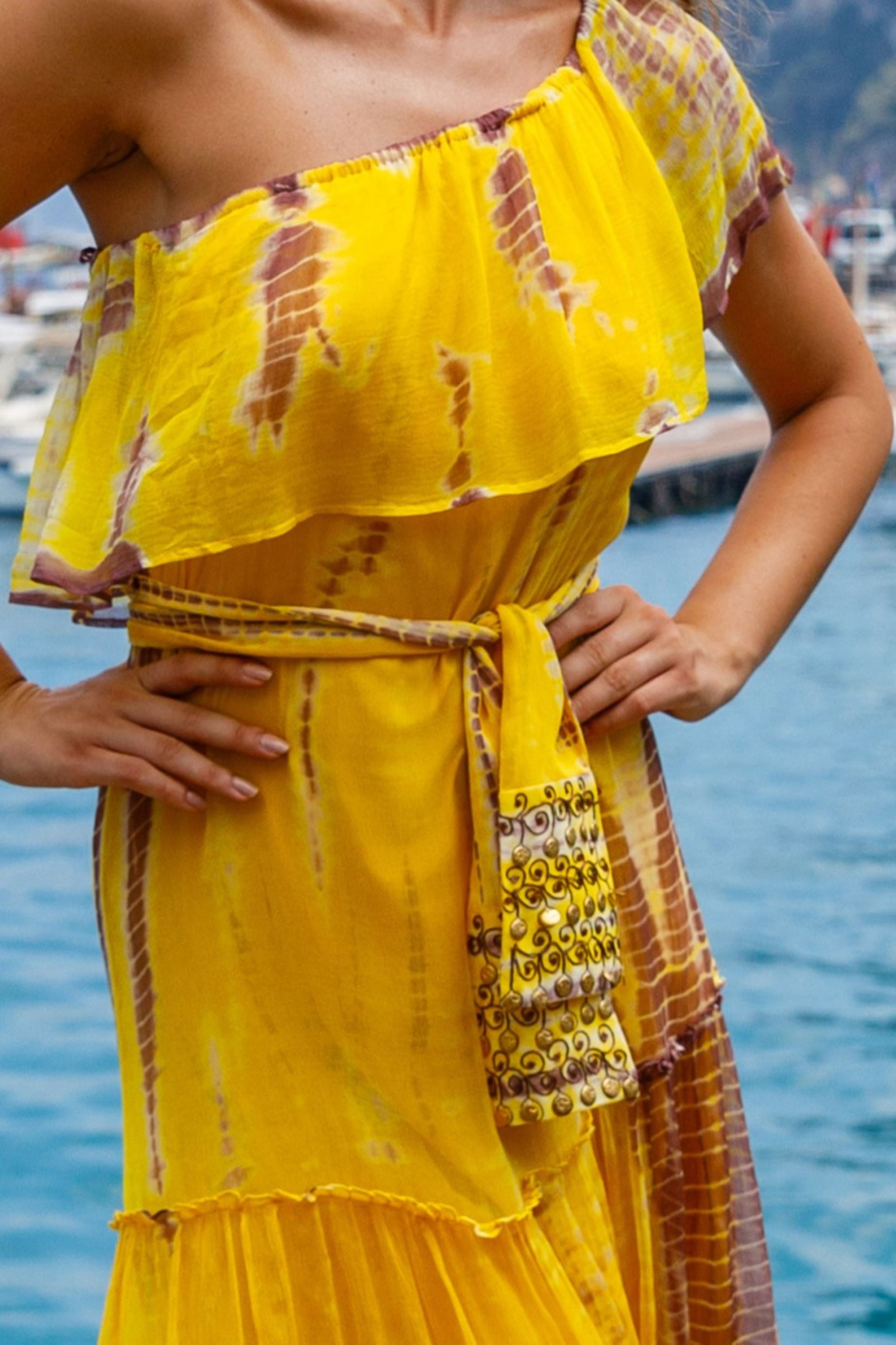 Yellow one shoulder silk maxi dresses to wear on holiday by Lindsey Brown resort wear