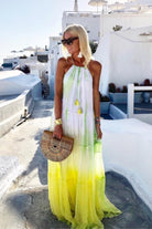 Yellow silk maxi dresses to wear on holiday in Santorini by Lindsey Brown resort wear 